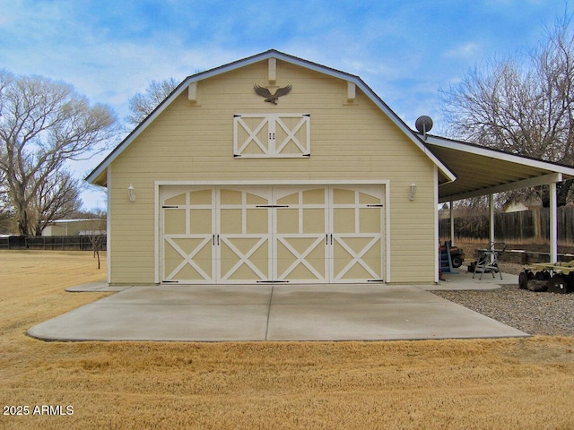 view of outdoor structure featuring a yard and a garage