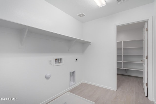 laundry room featuring laundry area, visible vents, gas dryer hookup, hookup for a washing machine, and hookup for an electric dryer