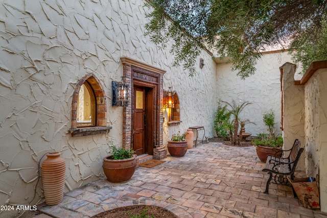 doorway to property featuring a patio area