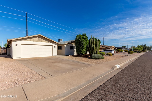 single story home featuring a garage