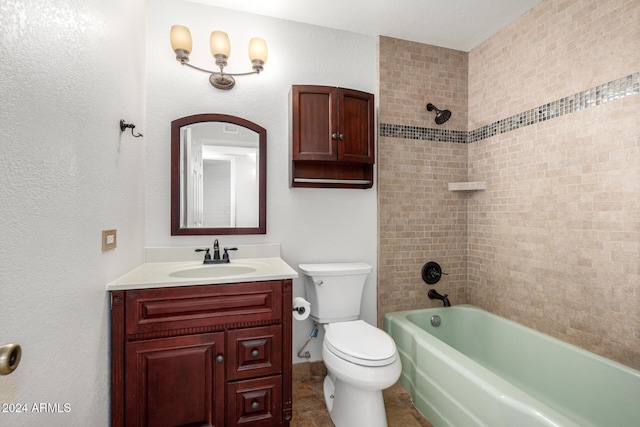 full bathroom with vanity, toilet, and tiled shower / bath