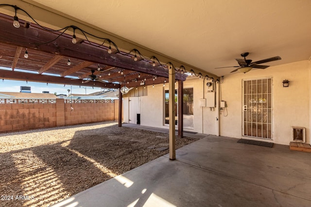 view of patio / terrace featuring ceiling fan and a pergola