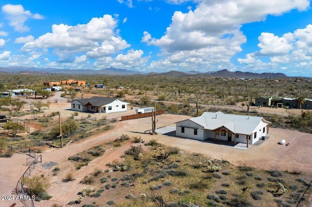 birds eye view of property featuring a mountain view