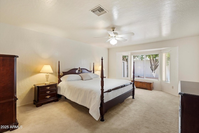 63 W Los Arboles Dr, Tempe, AZ 85284 - bedroom featuring visible vents, ceiling fan, light carpet, and baseboards