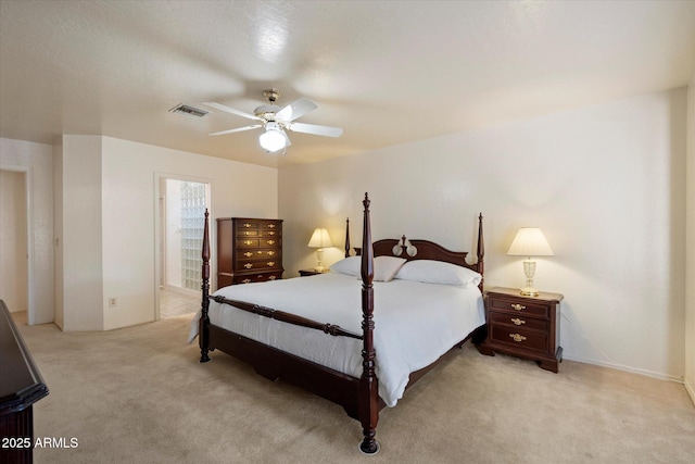 63 W Los Arboles Dr, Tempe, AZ 85284 - bedroom featuring visible vents, a ceiling fan, ensuite bathroom, and light colored carpet