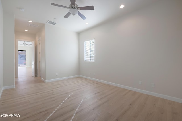 empty room featuring visible vents, recessed lighting, and light wood-type flooring