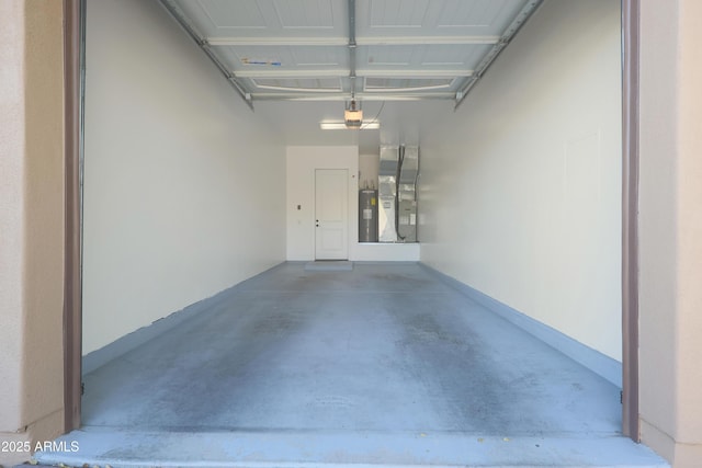 garage with heating unit, electric water heater, and a garage door opener