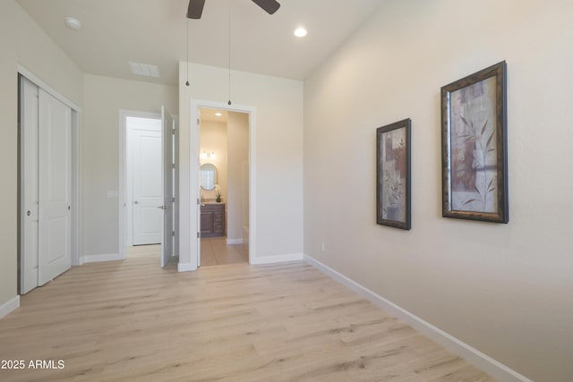 unfurnished bedroom with visible vents, baseboards, light wood finished floors, ensuite bath, and recessed lighting