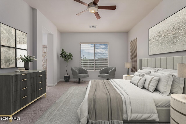 carpeted bedroom with baseboards, visible vents, and a ceiling fan