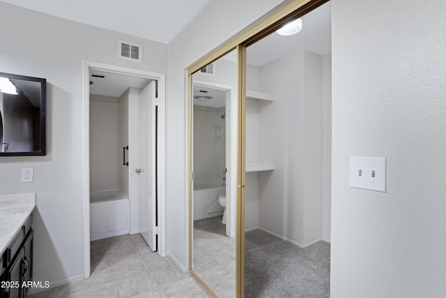 4790 E Navajo St, Phoenix, AZ 85044 - bathroom featuring vanity, a bathtub, toilet, baseboards, and tile patterned flooring