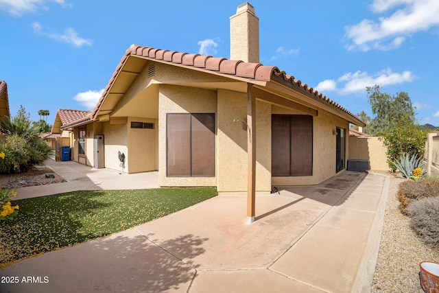 4790 E Navajo St, Phoenix, AZ 85044 - rear view of property featuring stucco siding, a tile roof, a patio, and a chimney