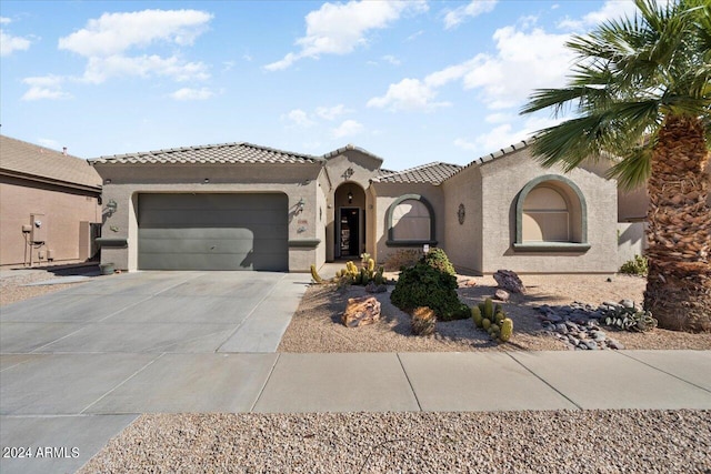 mediterranean / spanish-style house featuring a garage