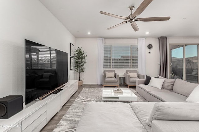 living room featuring wood finished floors, ceiling fan, and recessed lighting