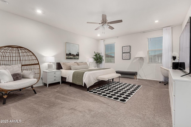 carpeted bedroom featuring baseboards and recessed lighting