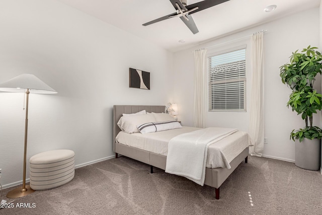 bedroom featuring ceiling fan, carpet flooring, and baseboards