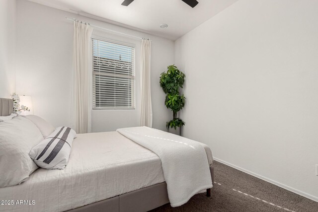 bedroom with carpet flooring, baseboards, and a ceiling fan