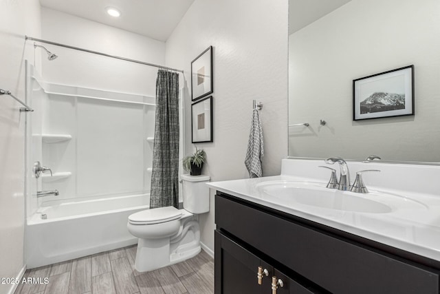 full bathroom with toilet, shower / bath combo with shower curtain, wood finish floors, and vanity