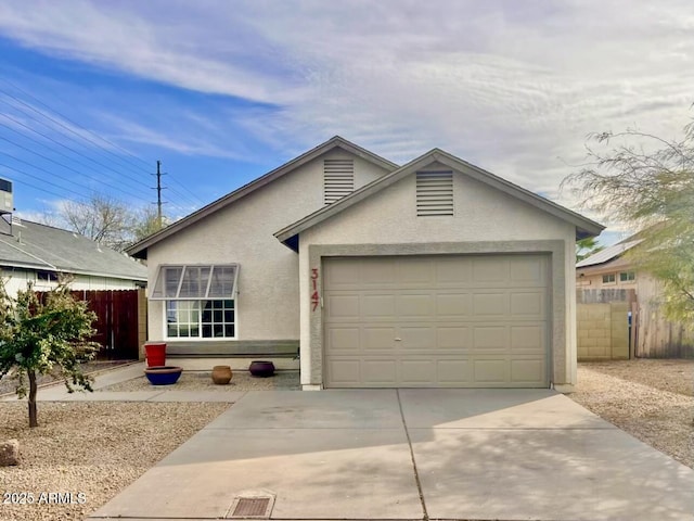 ranch-style home featuring a garage