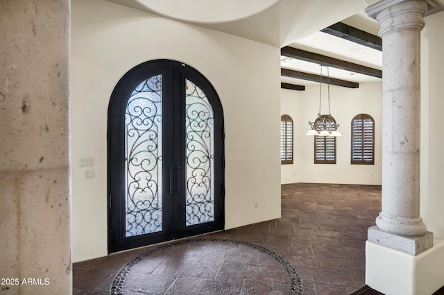 2300 E Sanoque Ct, Gilbert, AZ 85298 - entryway with stone tile flooring, french doors, arched walkways, beam ceiling, and decorative columns