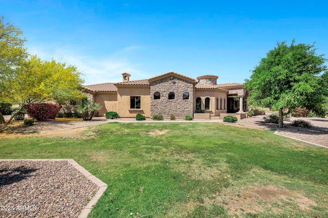2300 E Sanoque Ct, Gilbert, AZ 85298 - back of property featuring stucco siding, stone siding, a tiled roof, and a lawn