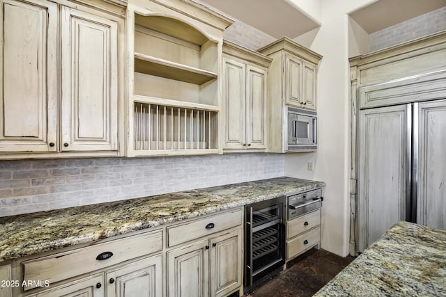 2300 E Sanoque Ct, Gilbert, AZ 85298 - kitchen with beverage cooler, stainless steel microwave, cream cabinetry, open shelves, and backsplash