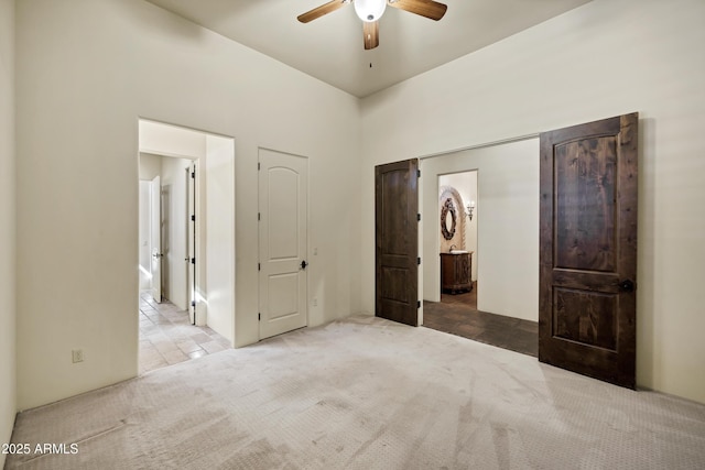 2300 E Sanoque Ct, Gilbert, AZ 85298 - unfurnished bedroom featuring carpet floors, ensuite bathroom, and ceiling fan