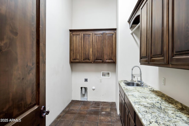 2300 E Sanoque Ct, Gilbert, AZ 85298 - washroom with cabinet space, hookup for a gas dryer, hookup for an electric dryer, hookup for a washing machine, and dark stone finish floors