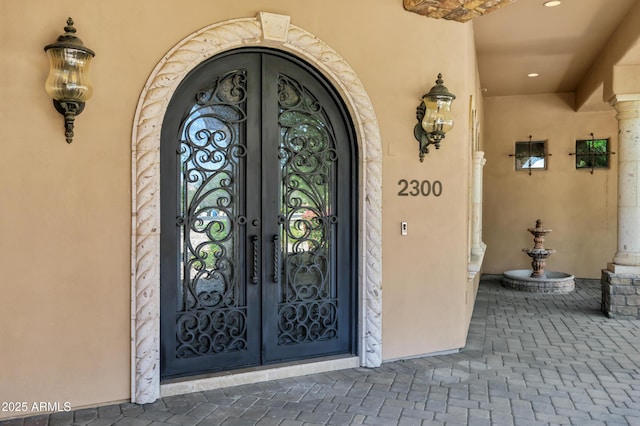 2300 E Sanoque Ct, Gilbert, AZ 85298 - doorway to property featuring french doors and stucco siding