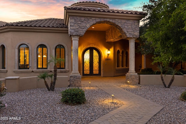 2300 E Sanoque Ct, Gilbert, AZ 85298 - view of front facade with stucco siding, a tiled roof, french doors, and stone siding