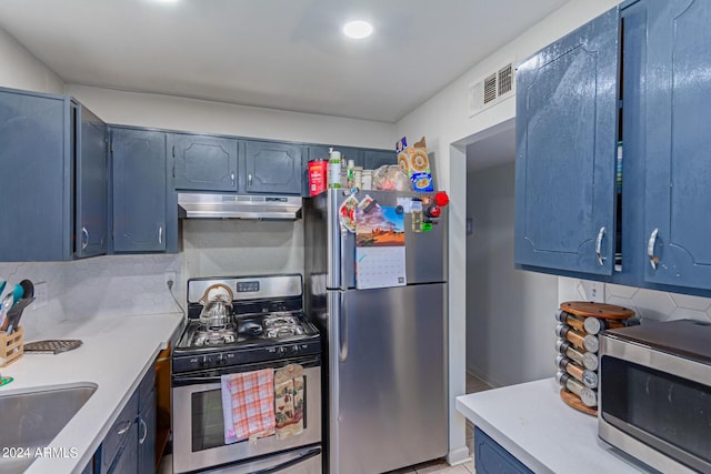 kitchen with visible vents, decorative backsplash, stainless steel appliances, light countertops, and under cabinet range hood