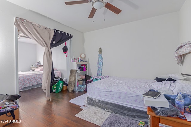 bedroom with ceiling fan and wood finished floors