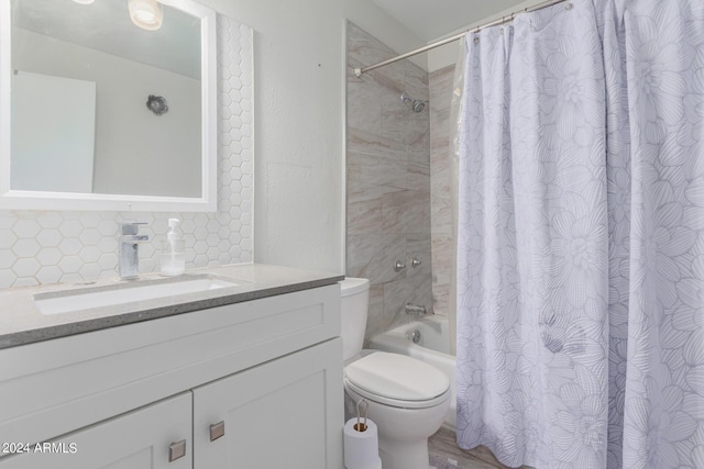 full bathroom featuring toilet, shower / tub combo with curtain, backsplash, and vanity