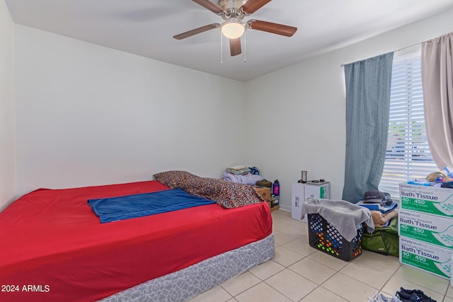 bedroom with tile patterned flooring and a ceiling fan