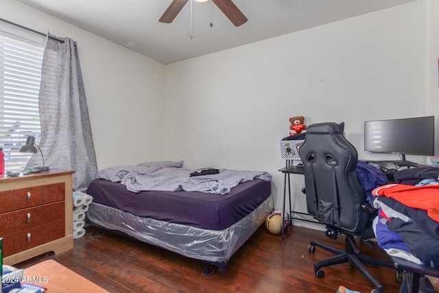 bedroom featuring a ceiling fan and wood finished floors