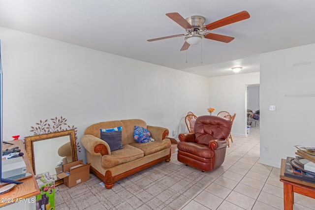 living room featuring light tile patterned floors and ceiling fan