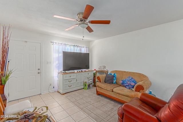 living room featuring a ceiling fan and light tile patterned flooring