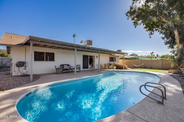 view of swimming pool featuring a patio area