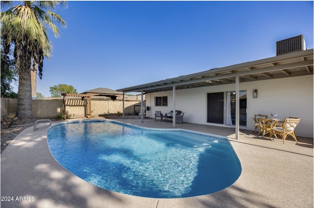 view of swimming pool with a patio area