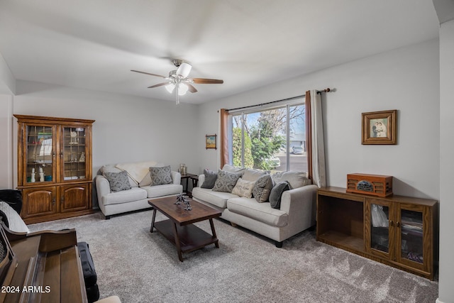 living room featuring carpet flooring and ceiling fan