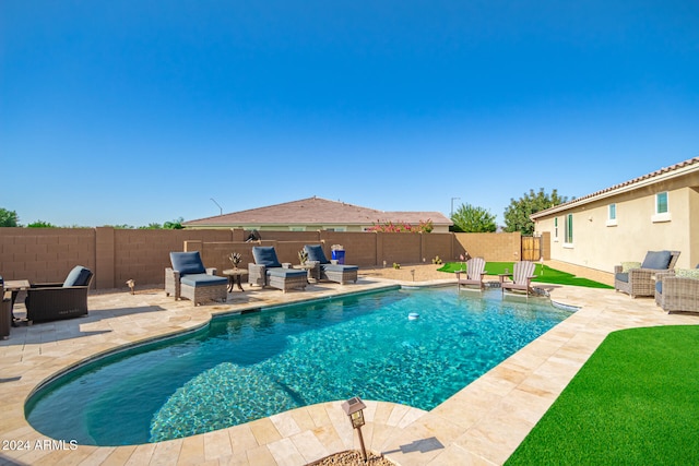 view of swimming pool featuring a yard, outdoor lounge area, and a patio