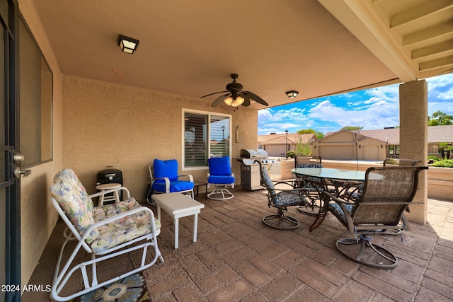 view of patio featuring ceiling fan and a grill