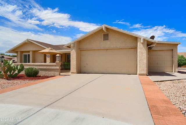 ranch-style home featuring a garage