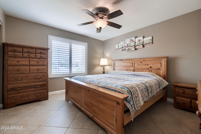 tiled bedroom featuring ceiling fan