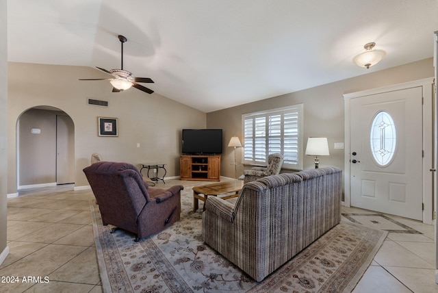 living room featuring light tile patterned flooring, ceiling fan, and lofted ceiling