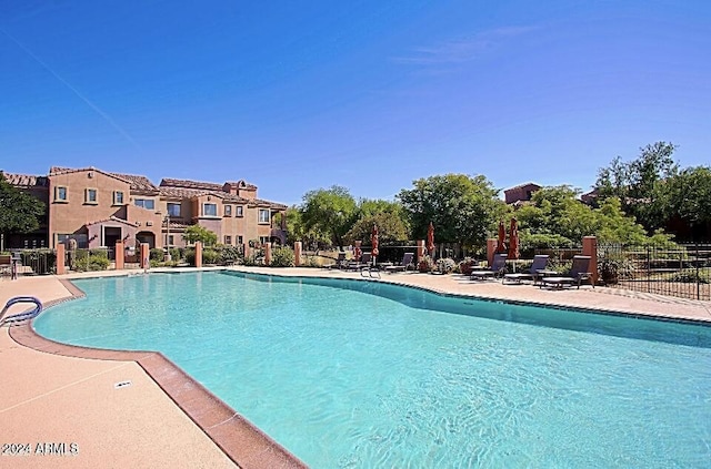 3935 E Rough Rider Rd Unit 1101, Phoenix, AZ 85050 - community pool with a patio