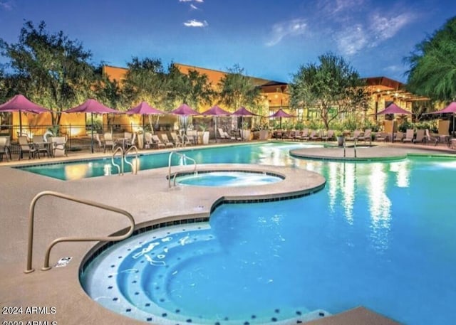 3935 E Rough Rider Rd Unit 1101, Phoenix, AZ 85050 - community pool with a hot tub and a patio