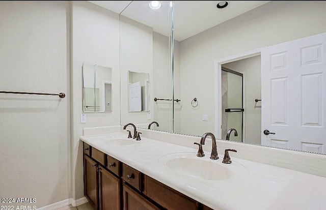3935 E Rough Rider Rd Unit 1101, Phoenix, AZ 85050 - bathroom featuring double vanity and a shower with shower door