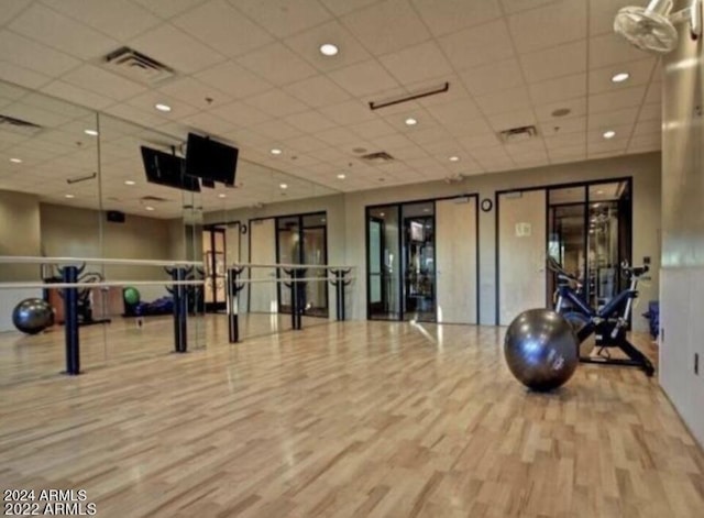 3935 E Rough Rider Rd Unit 1101, Phoenix, AZ 85050 - exercise room featuring wood finished floors and a drop ceiling
