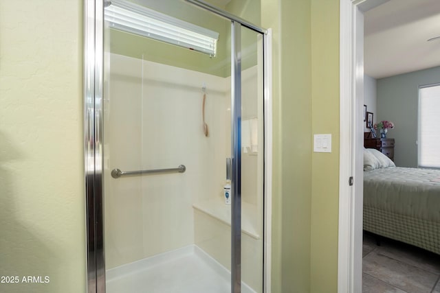 bathroom featuring ensuite bath and a shower stall