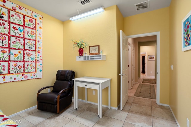 sitting room featuring visible vents and tile patterned floors